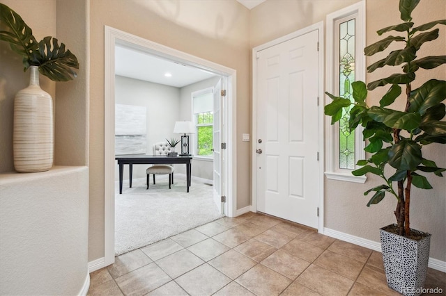 2601 Pemberly Ave, Highlands Ranch, CO 80126 - foyer featuring baseboards, light carpet, and light tile patterned floors
