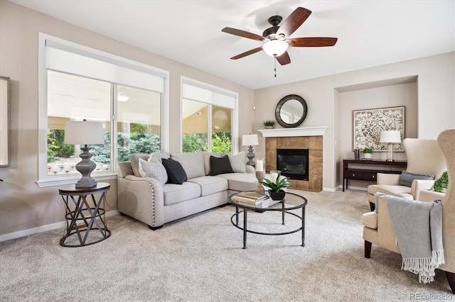 2601 Pemberly Ave, Highlands Ranch, CO 80126 - living area featuring carpet floors, a ceiling fan, baseboards, and a tiled fireplace