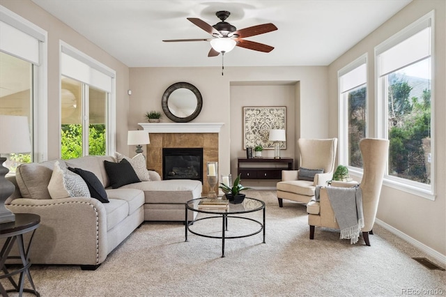 2601 Pemberly Ave, Highlands Ranch, CO 80126 - living room featuring plenty of natural light, ceiling fan, light carpet, and a tiled fireplace