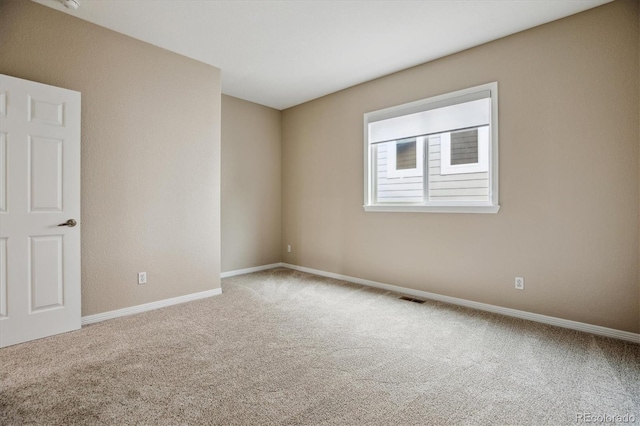 2601 Pemberly Ave, Highlands Ranch, CO 80126 - spare room featuring carpet and baseboards