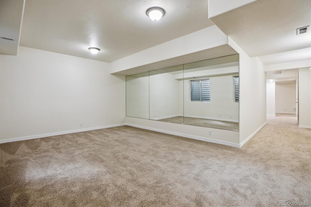 2601 Pemberly Ave, Highlands Ranch, CO 80126 - finished basement featuring carpet floors, baseboards, and a textured ceiling