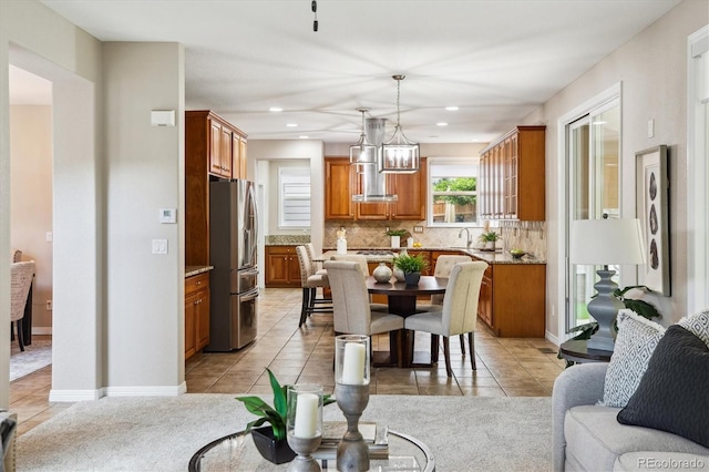 2601 Pemberly Ave, Highlands Ranch, CO 80126 - dining space featuring light tile patterned flooring and recessed lighting