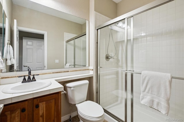 2601 Pemberly Ave, Highlands Ranch, CO 80126 - bathroom featuring vanity, toilet, and a shower stall