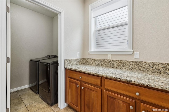 2601 Pemberly Ave, Highlands Ranch, CO 80126 - washroom featuring separate washer and dryer and light tile patterned floors