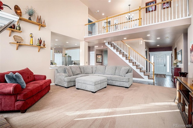 living room featuring a high ceiling and carpet floors