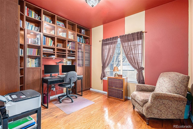 office area with wood-type flooring