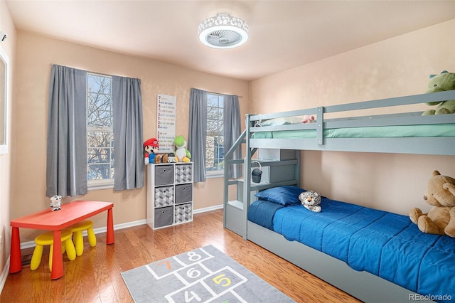 bedroom with hardwood / wood-style flooring