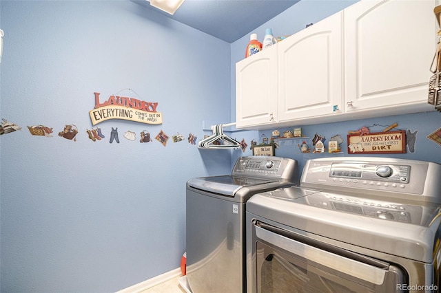 laundry area featuring cabinets and independent washer and dryer