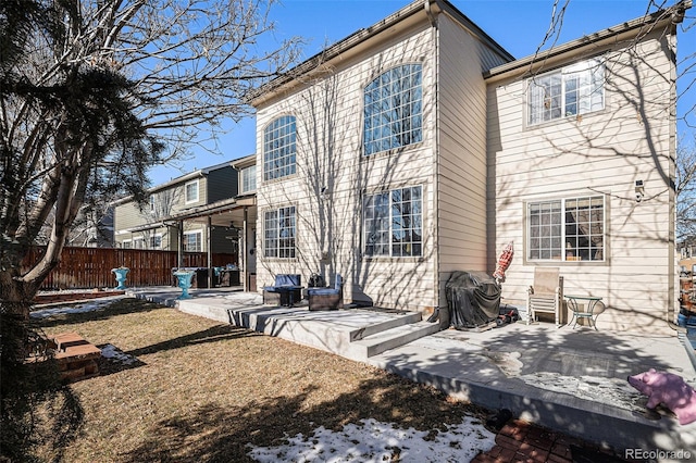 rear view of property featuring a patio