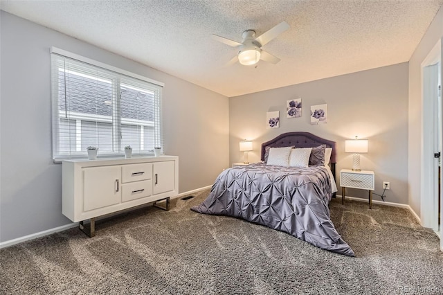 bedroom featuring carpet flooring, a textured ceiling, a ceiling fan, and baseboards