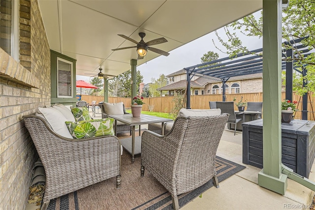 view of patio featuring an outdoor hangout area, a fenced backyard, ceiling fan, outdoor dining space, and a pergola