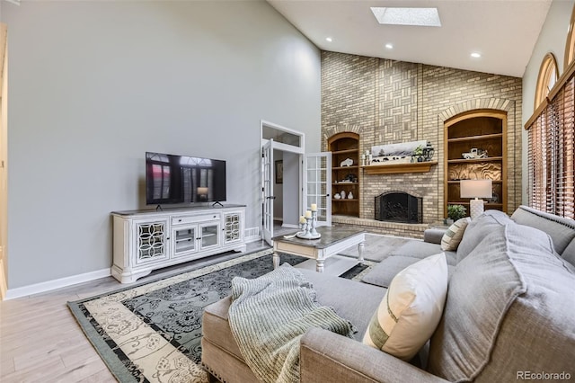 5426 S Jasper Way, Centennial, CO 80015 - living room with a skylight, high vaulted ceiling, wood finished floors, recessed lighting, and a fireplace