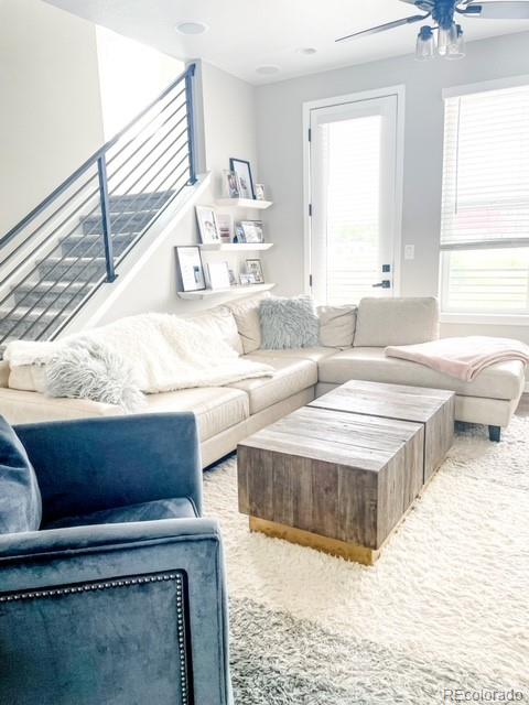 carpeted living room with a healthy amount of sunlight