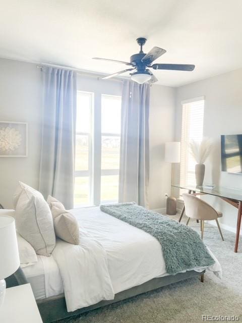 carpeted bedroom with ceiling fan