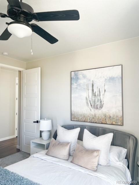 bedroom with wood-type flooring and ceiling fan