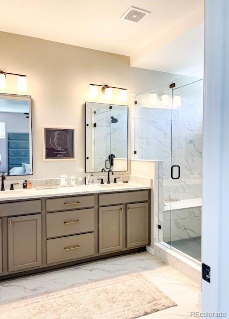 bathroom with vanity and walk in shower