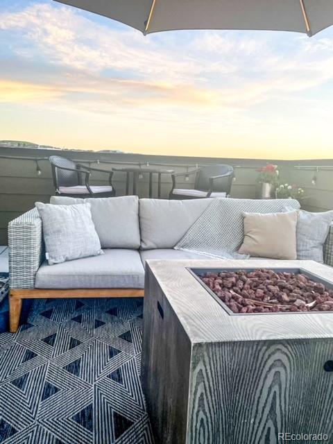 patio terrace at dusk with an outdoor fire pit