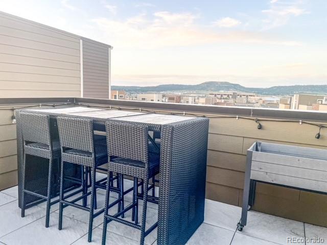 patio terrace at dusk with a mountain view