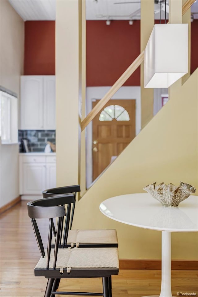 staircase with wood finished floors