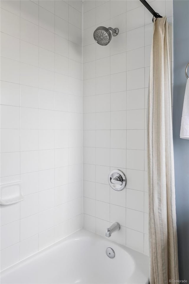 full bathroom with shower / bath combo with shower curtain