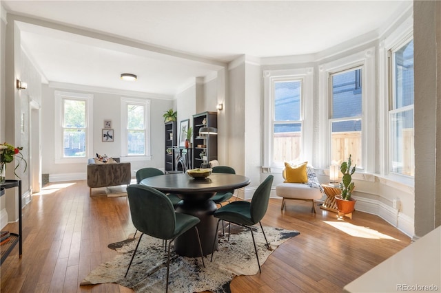 2355 N Emerson St, Denver, CO 80205 - dining area with hardwood / wood-style floors, ornamental molding, and baseboards