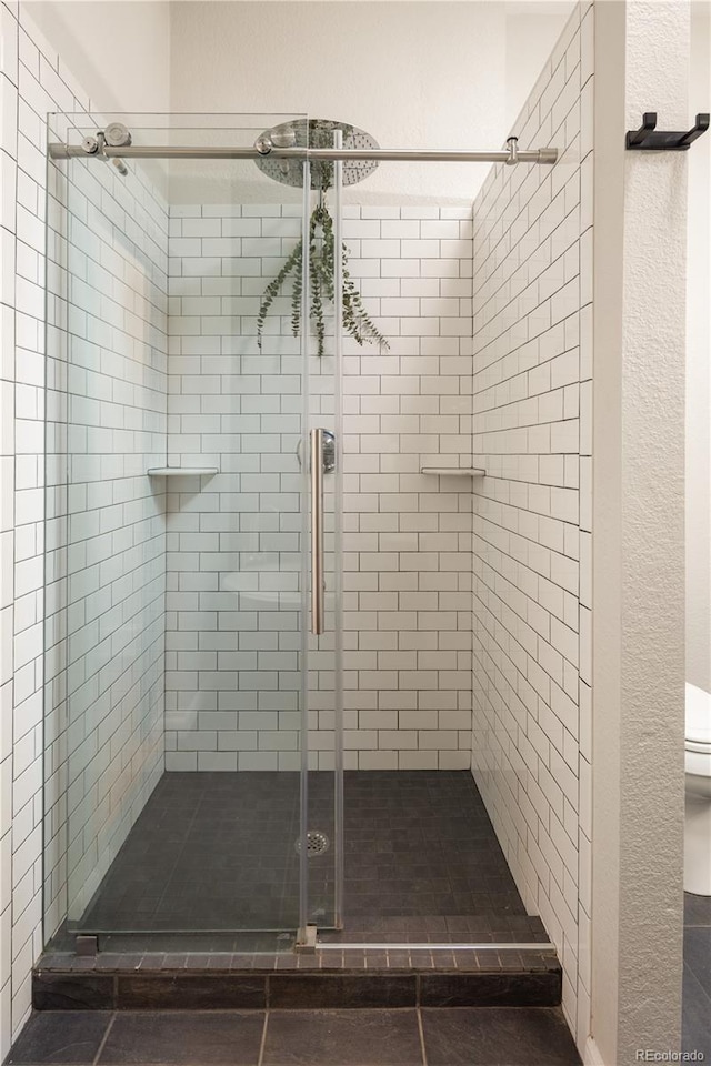 2355 N Emerson St, Denver, CO 80205 - full bath with a shower stall and toilet