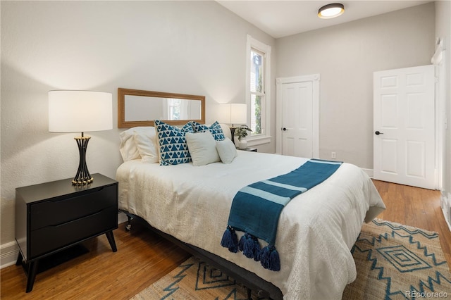 2355 N Emerson St, Denver, CO 80205 - bedroom with wood finished floors and baseboards