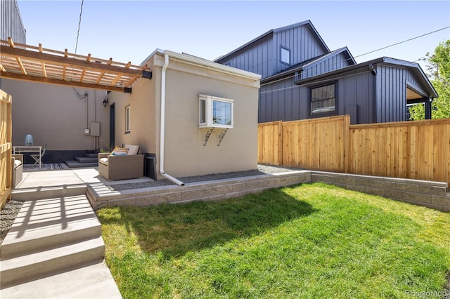 2355 N Emerson St, Denver, CO 80205 - rear view of property featuring a patio area, stucco siding, and an outdoor living space