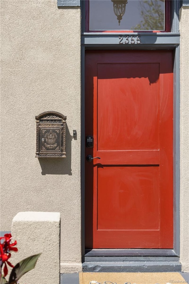 2355 N Emerson St, Denver, CO 80205 - property entrance featuring stucco siding
