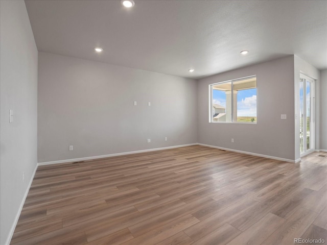 17557 E 89th Way, Commerce City, CO 80022 - spare room featuring light wood finished floors and recessed lighting