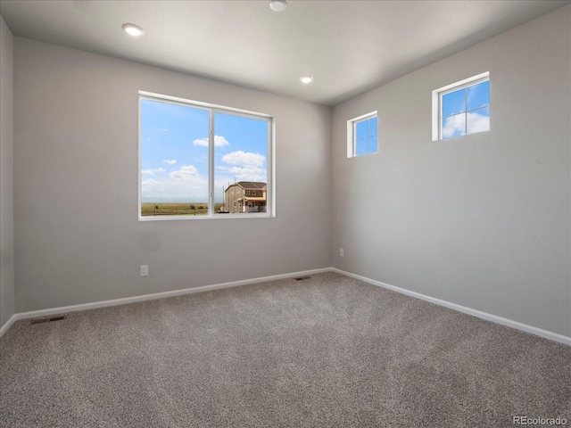 17557 E 89th Way, Commerce City, CO 80022 - empty room with carpet floors and recessed lighting