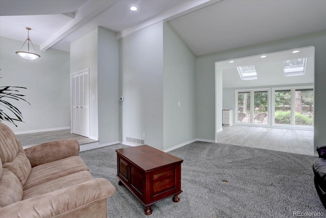 7715 S Hudson Ct, Centennial, CO 80122 - living room featuring a skylight, carpet, baseboards, recessed lighting, and beam ceiling