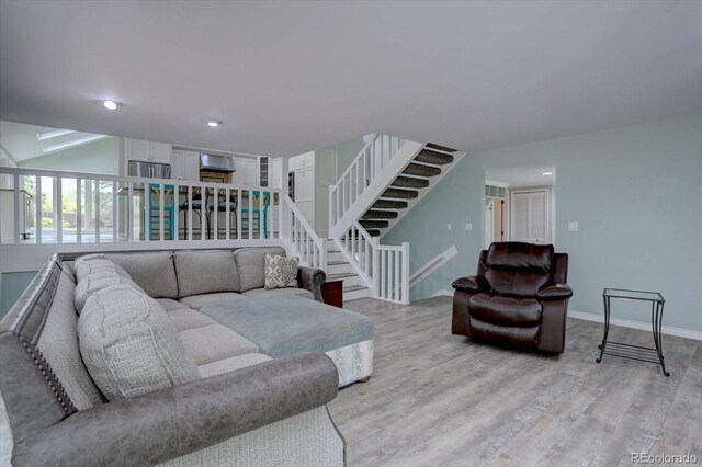 7715 S Hudson Ct, Centennial, CO 80122 - living area with stairs, light wood-style floors, baseboards, and recessed lighting