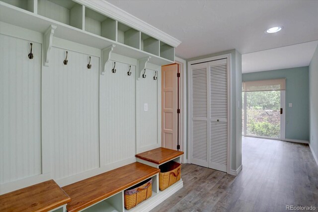 7715 S Hudson Ct, Centennial, CO 80122 - mudroom with wood finished floors, baseboards, and recessed lighting