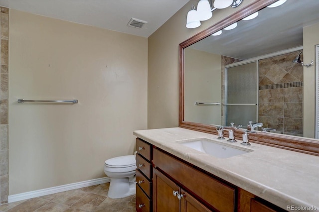 7715 S Hudson Ct, Centennial, CO 80122 - bathroom featuring toilet, vanity, a shower stall, baseboards, and tile patterned floors