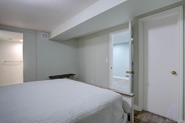 7715 S Hudson Ct, Centennial, CO 80122 - bedroom featuring wood finished floors and baseboards