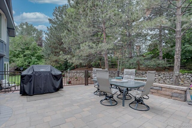 7715 S Hudson Ct, Centennial, CO 80122 - view of patio featuring grilling area and outdoor dining area