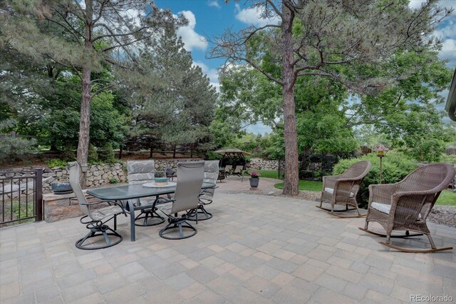 7715 S Hudson Ct, Centennial, CO 80122 - view of patio / terrace with outdoor dining space and view of scattered trees