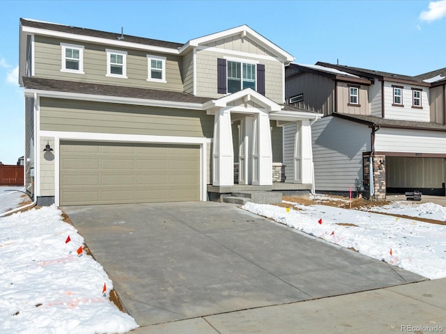 craftsman inspired home featuring an attached garage, board and batten siding, and concrete driveway