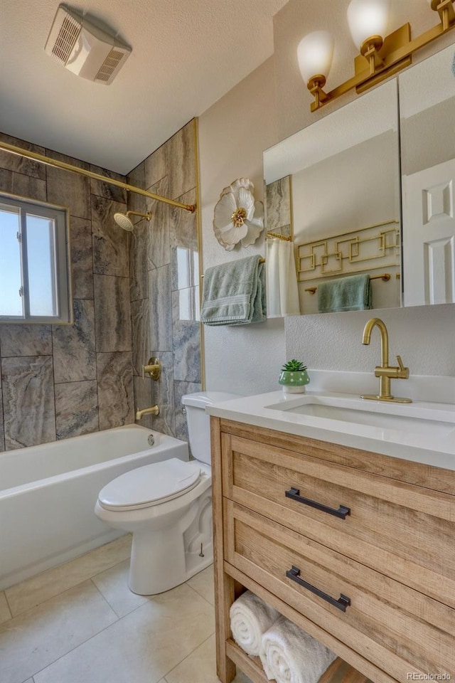 bathroom featuring vanity, visible vents, tile patterned floors, toilet, and shower / bathtub combination