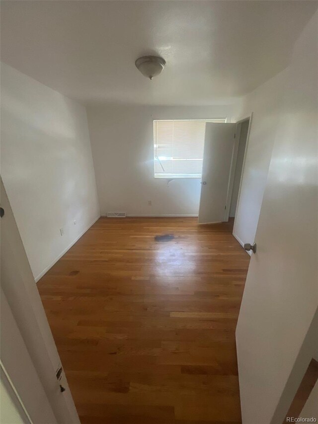 1533 S Jamaica St, Aurora, CO 80012 - empty room featuring light wood-type flooring