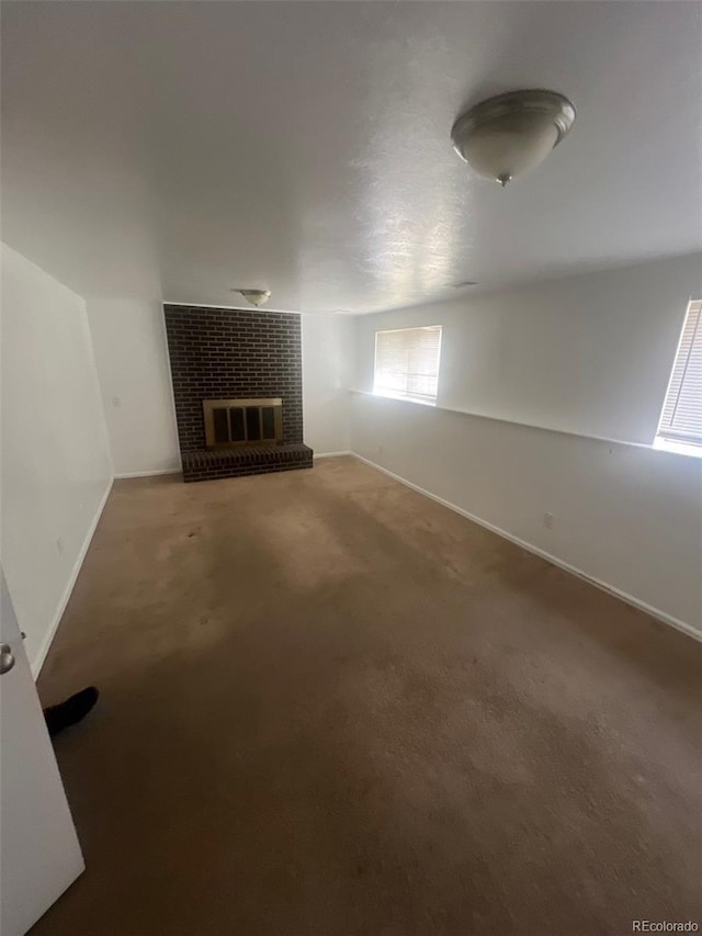 1533 S Jamaica St, Aurora, CO 80012 - unfurnished living room with a fireplace, carpet, and baseboards