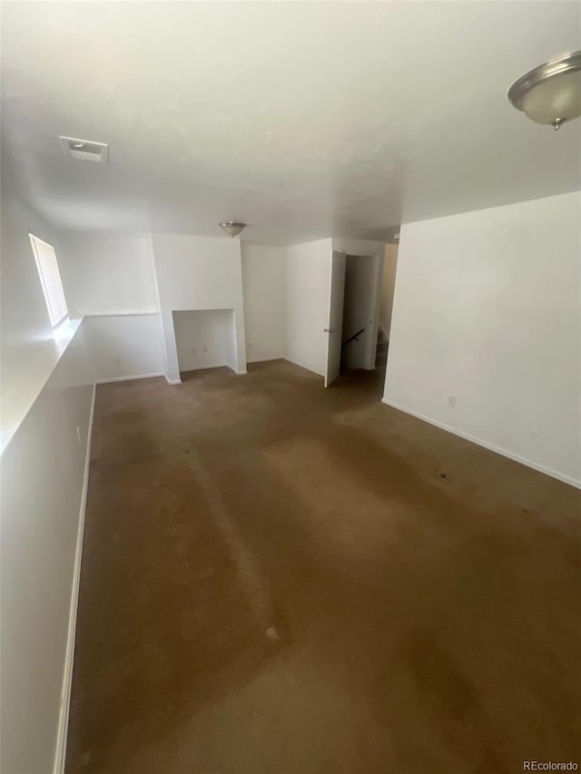 1533 S Jamaica St, Aurora, CO 80012 - below grade area with carpet floors and baseboards