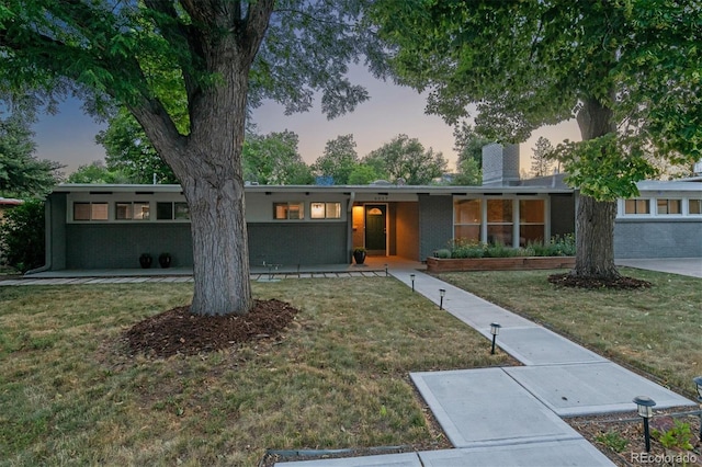 6057 S Windermere Way, Littleton, CO 80120 - view of front of home with a lawn