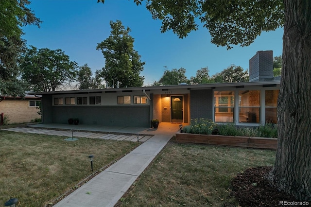 6057 S Windermere Way, Littleton, CO 80120 - single story home with a front yard and a chimney