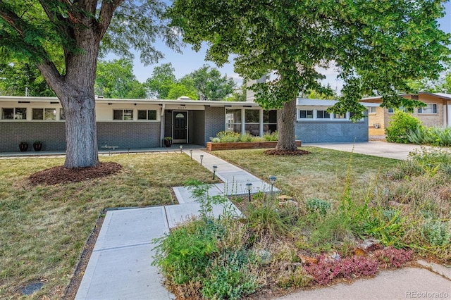 6057 S Windermere Way, Littleton, CO 80120 - ranch-style house featuring brick siding and a front lawn