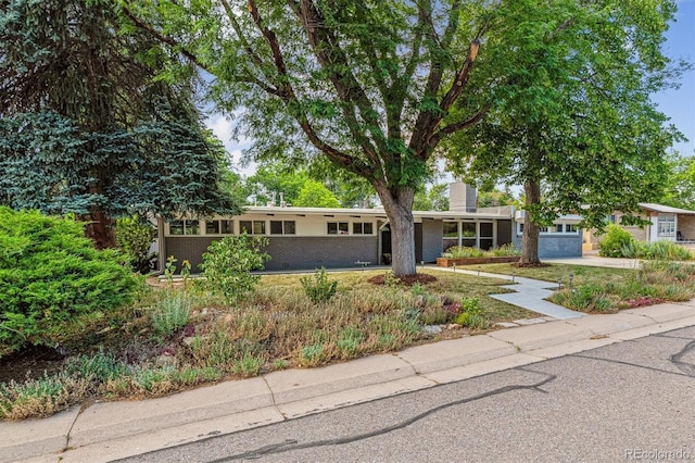 6057 S Windermere Way, Littleton, CO 80120 - view of front facade featuring driveway