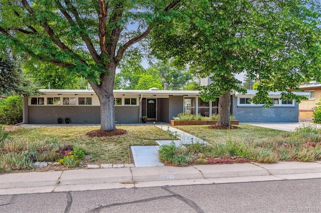 6057 S Windermere Way, Littleton, CO 80120 - view of front of house featuring brick siding and a front lawn
