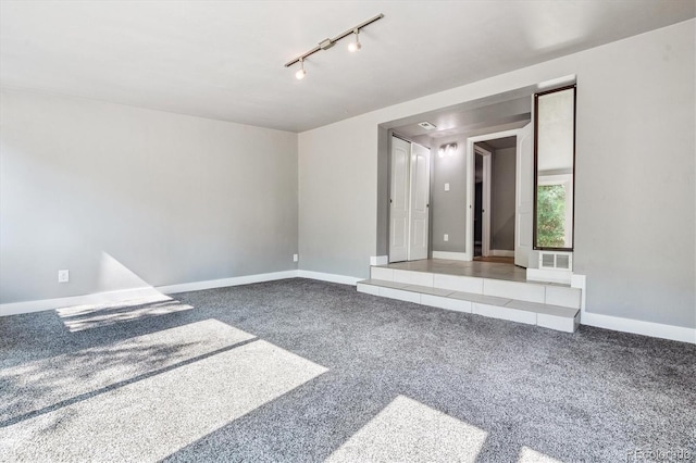 6057 S Windermere Way, Littleton, CO 80120 - carpeted empty room with track lighting and baseboards