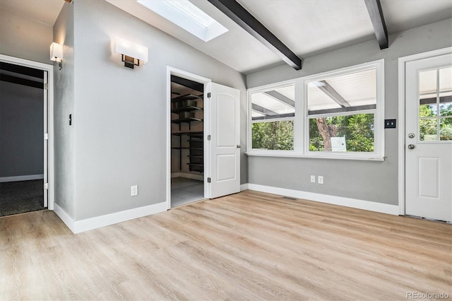 6057 S Windermere Way, Littleton, CO 80120 - foyer with a skylight, beam ceiling, and wood finished floors